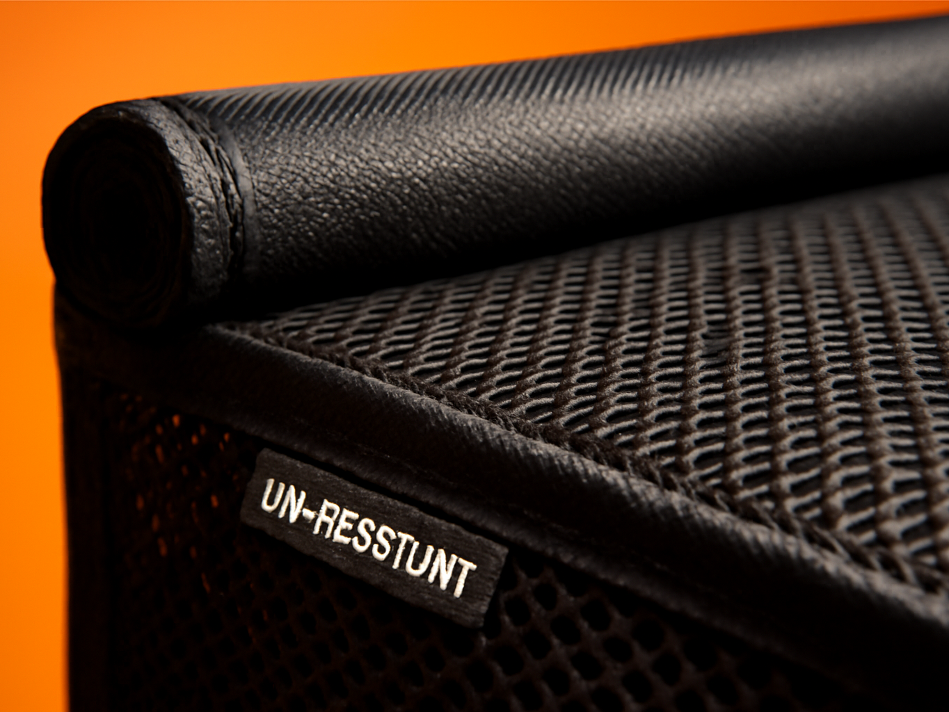 Close-up of black mesh fabric weave on Kylinlucky AC cover showing breathable texture and stitched edge detail